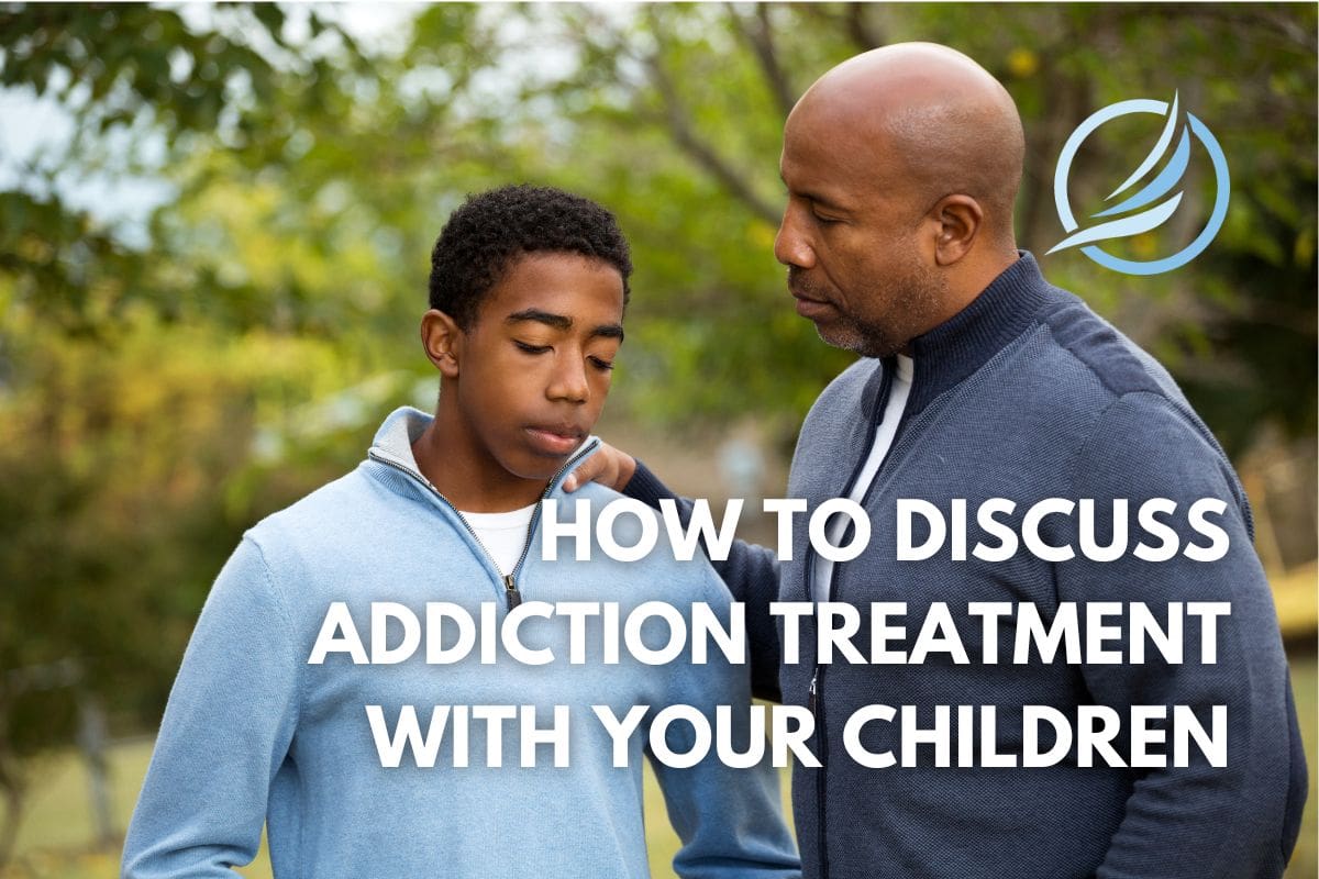 an image of a father talking to his child about starting addiction treatment.