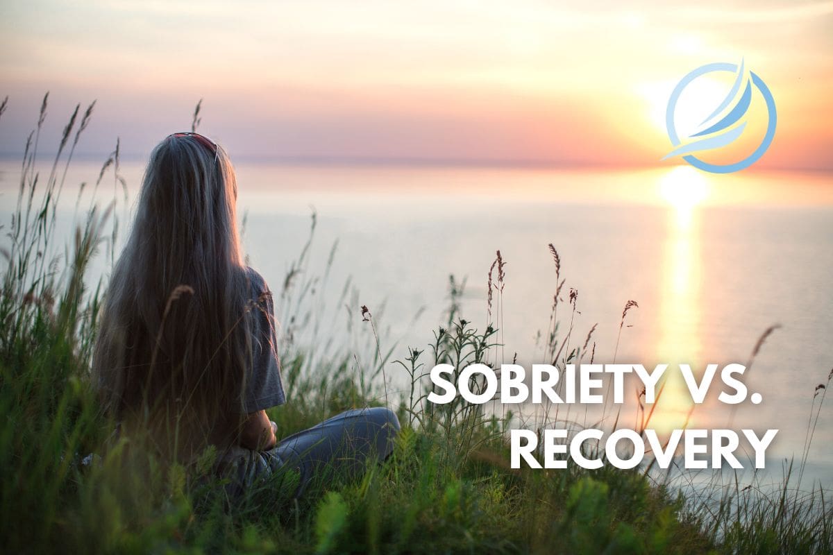 an image of a female who is in deep reflection about her path and what sobriety vs. recovery. Learning the differences and similarities.